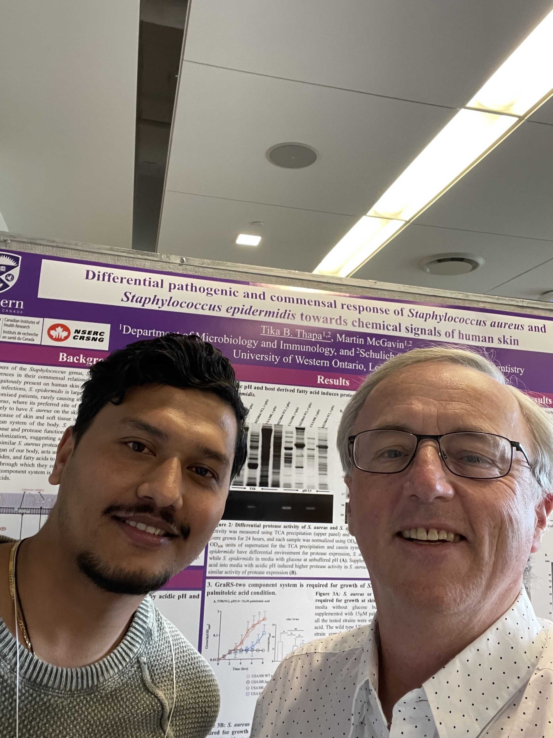 Tika Thapa and Dr. McGavin at their poster on S. aureus and S. epidermidis